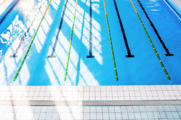 Lanes of an indoor public swimming pool. Top view.